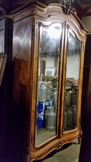 A Walnut Armoire with Mirrored Doors