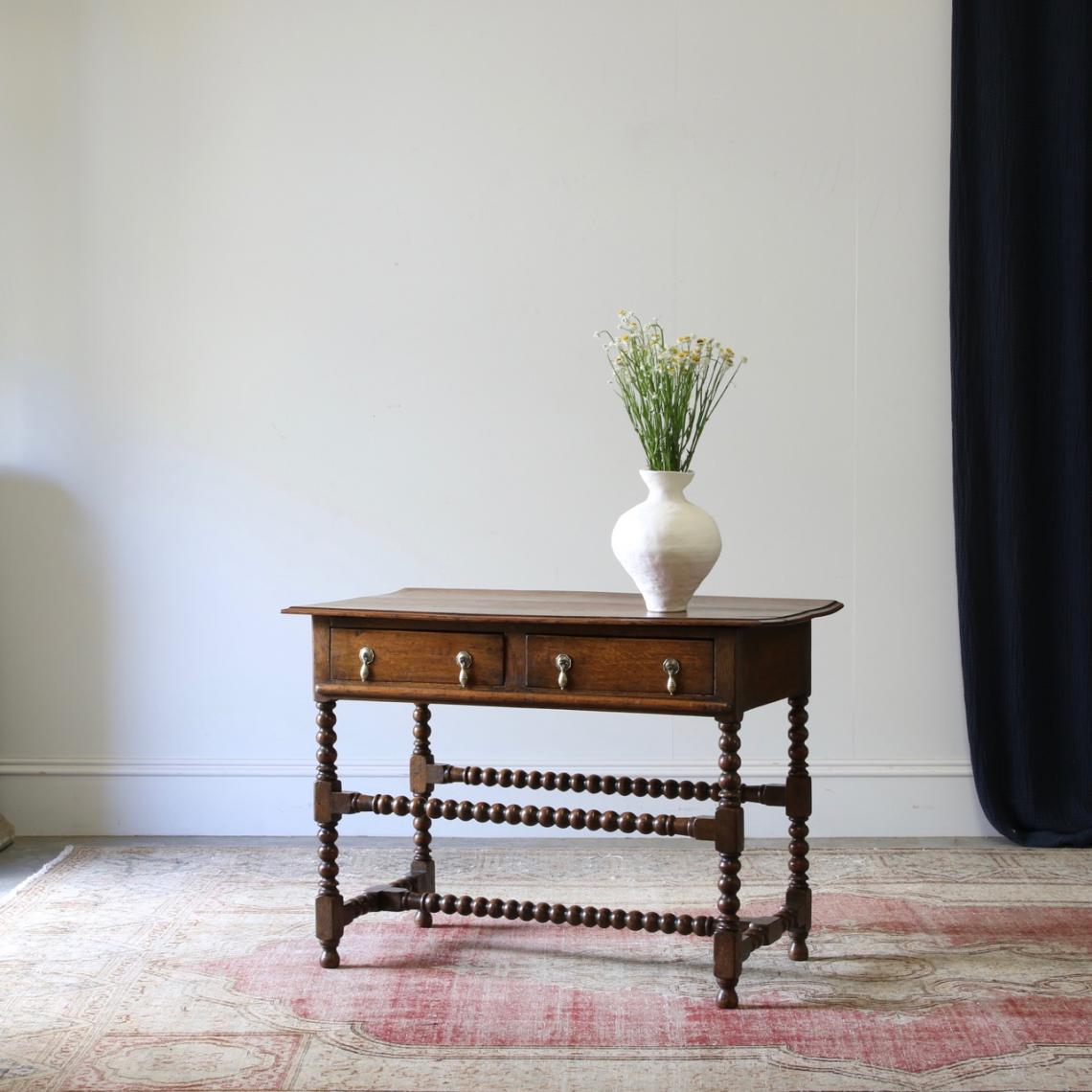 A Two Drawer Jacobean Oak Side Table