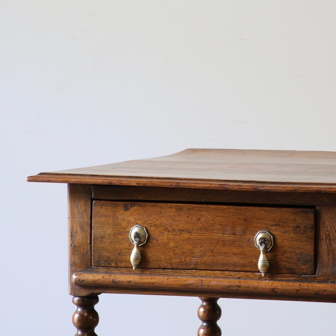 A Two Drawer Jacobean Oak Side Table