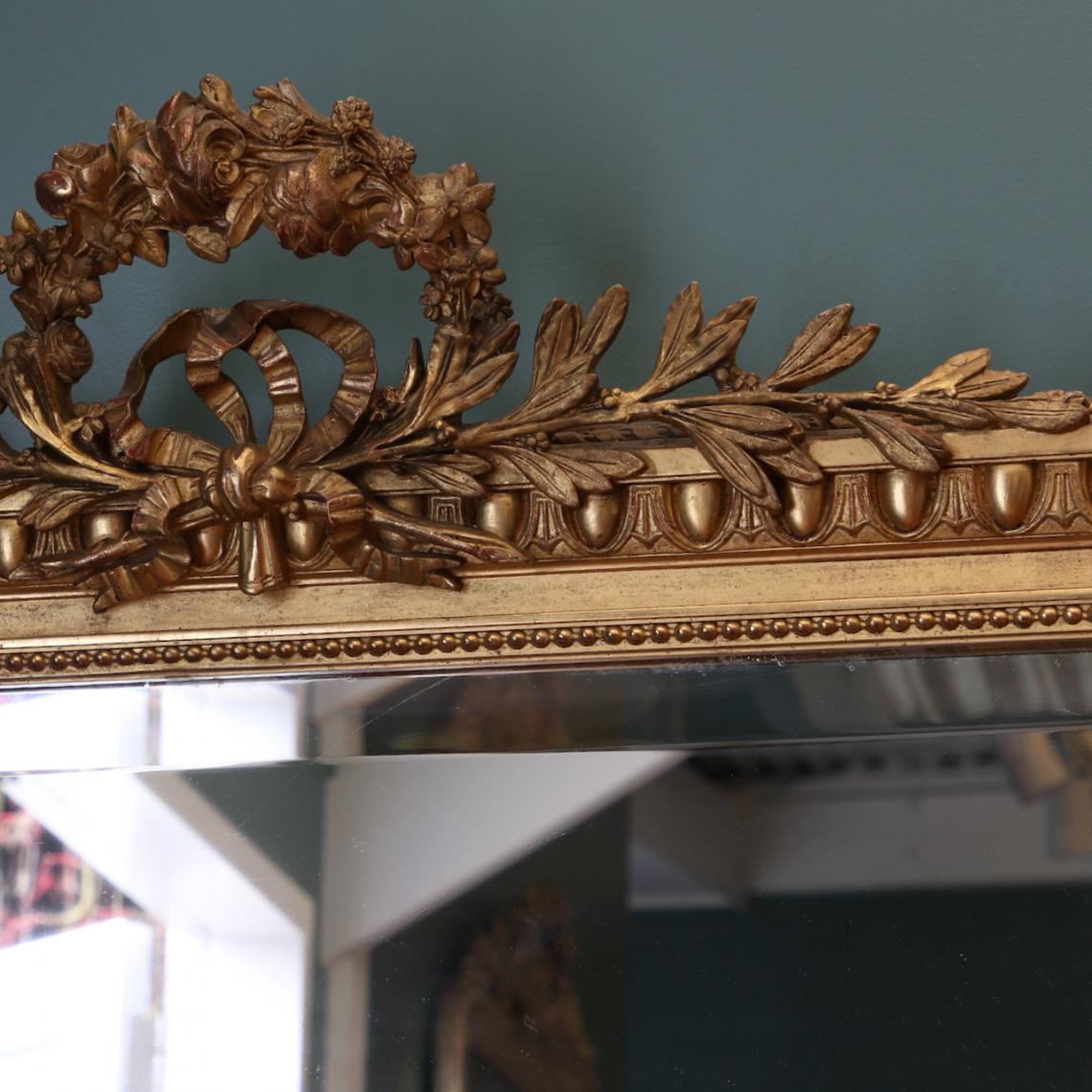 A Gold and Crested Portrait Mirror 