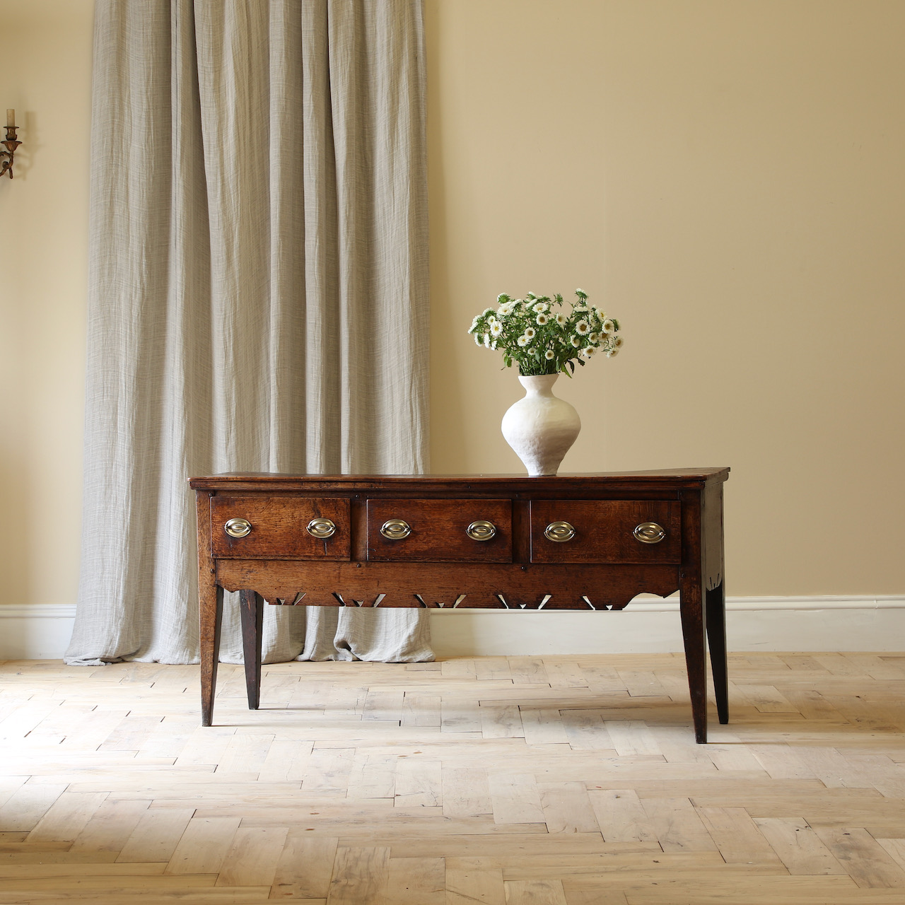 A Three Drawer English Oak Side Table