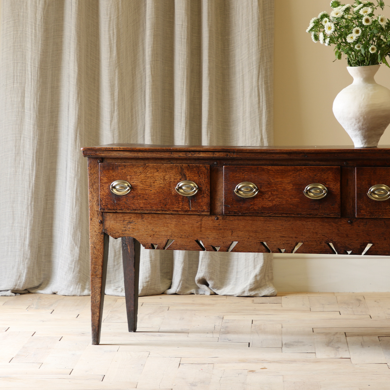 A Three Drawer English Oak Side Table