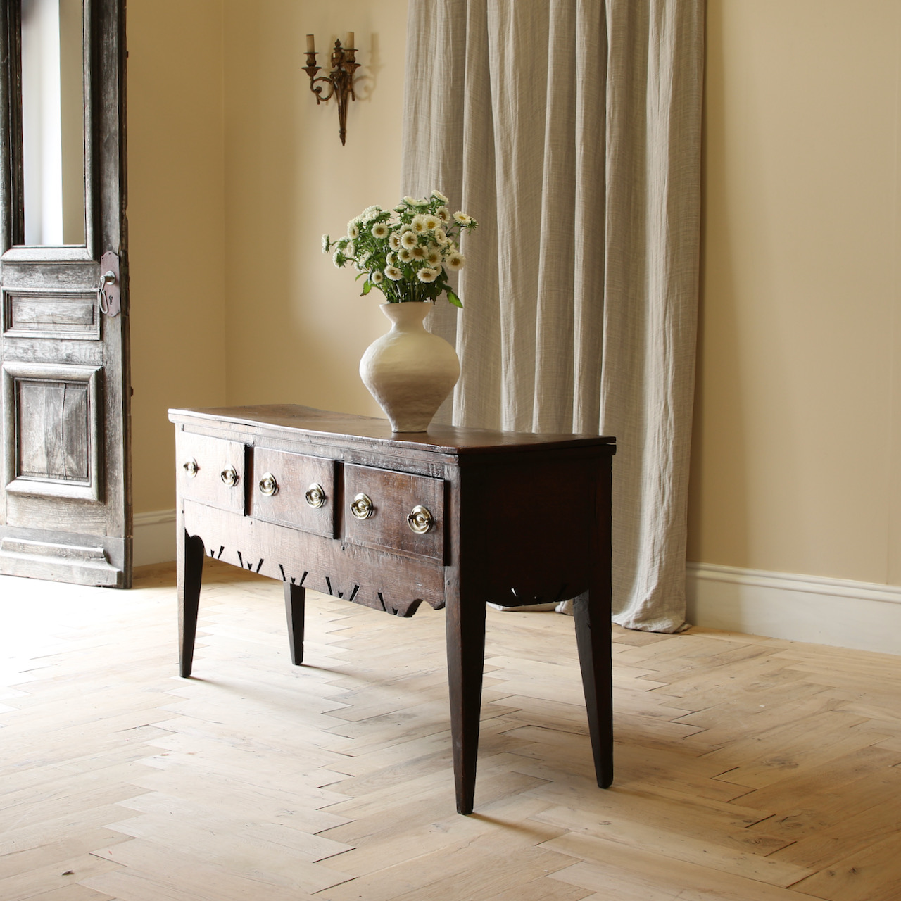 A Three Drawer English Oak Side Table