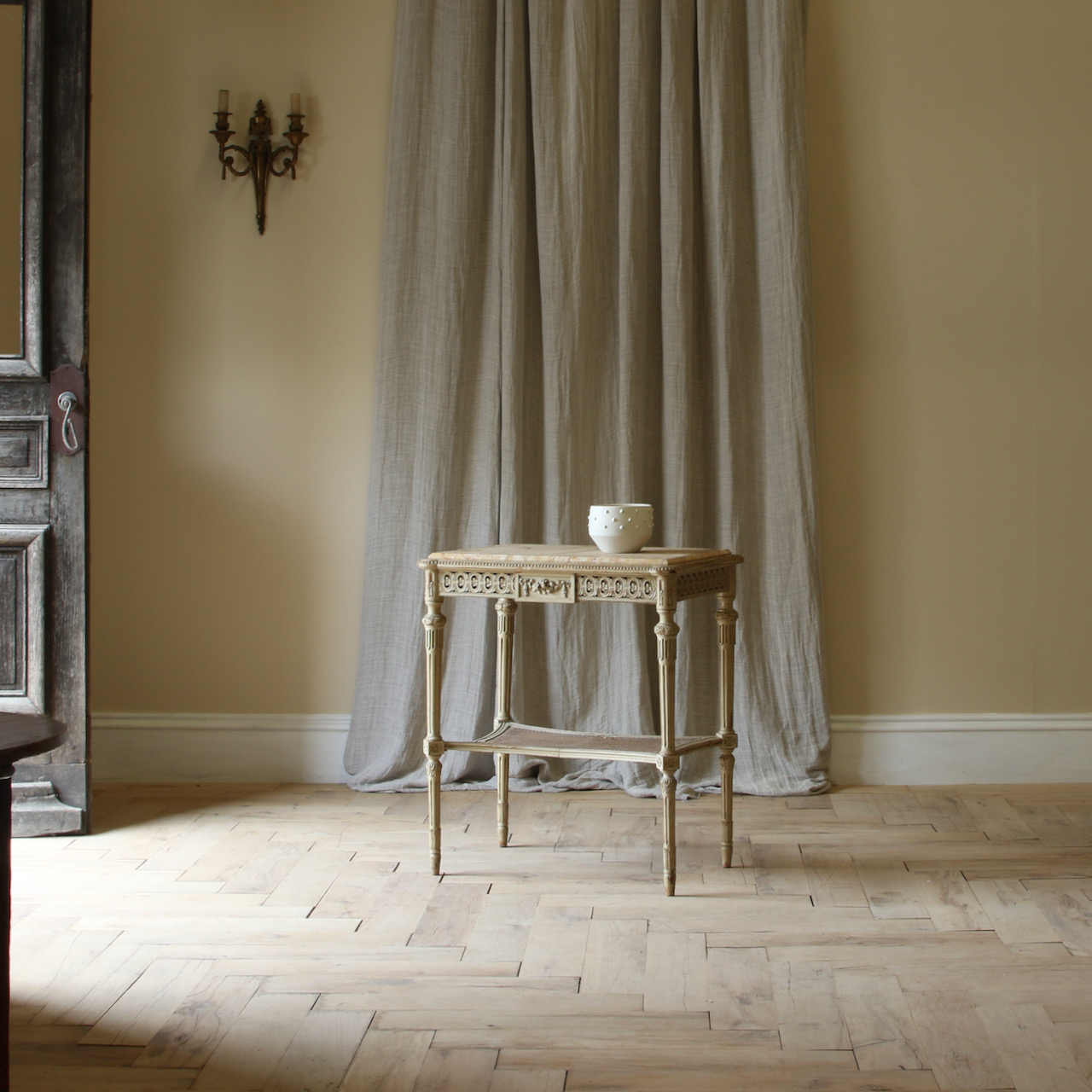 A Caned and Marble-Topped Table