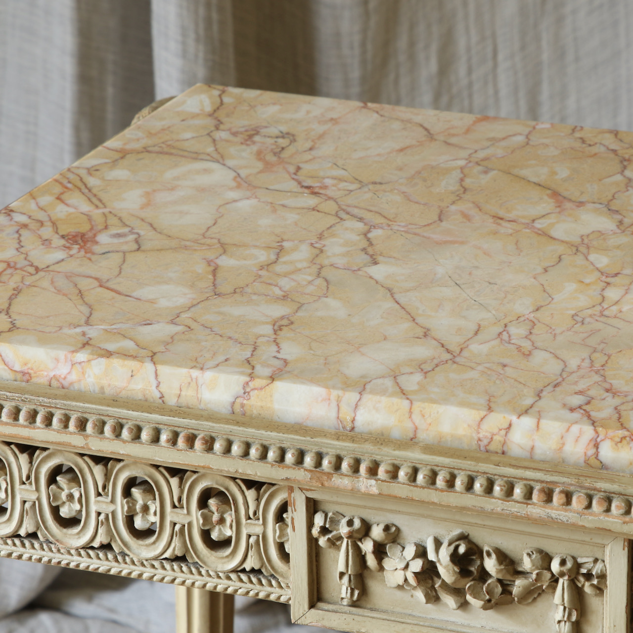 A Caned and Marble-Topped Table
