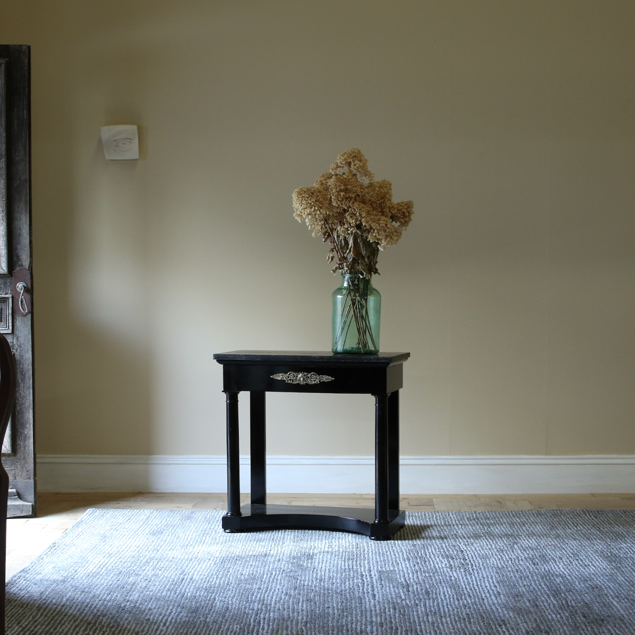 An Ebonised Empire Console