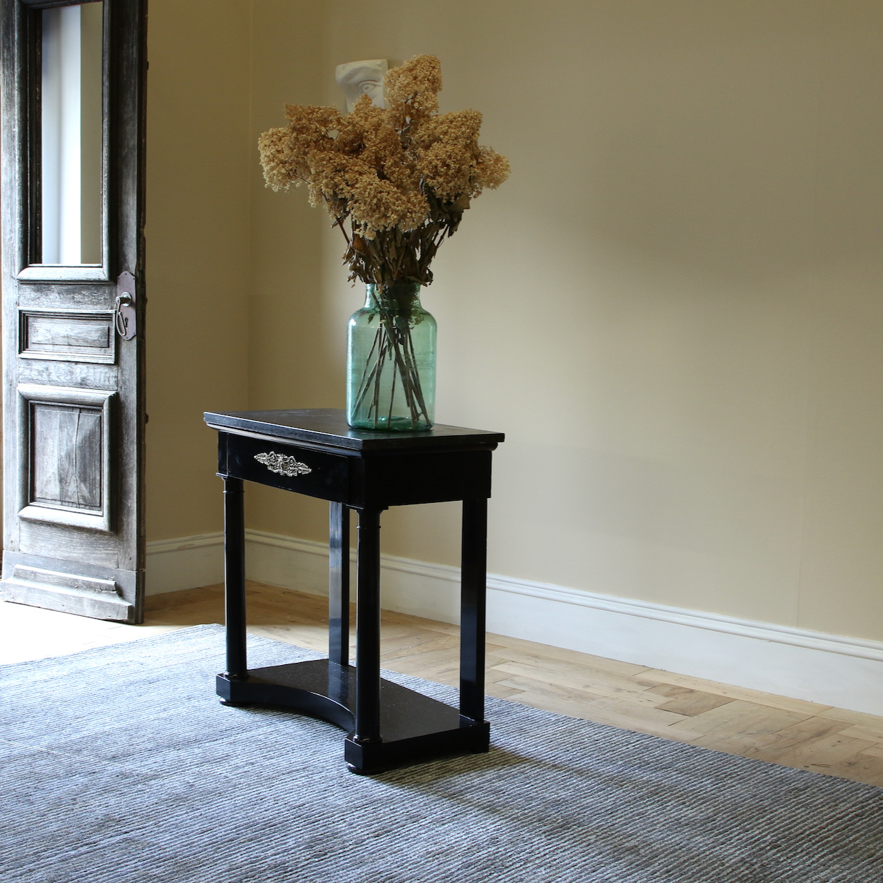 An Ebonised Empire Console