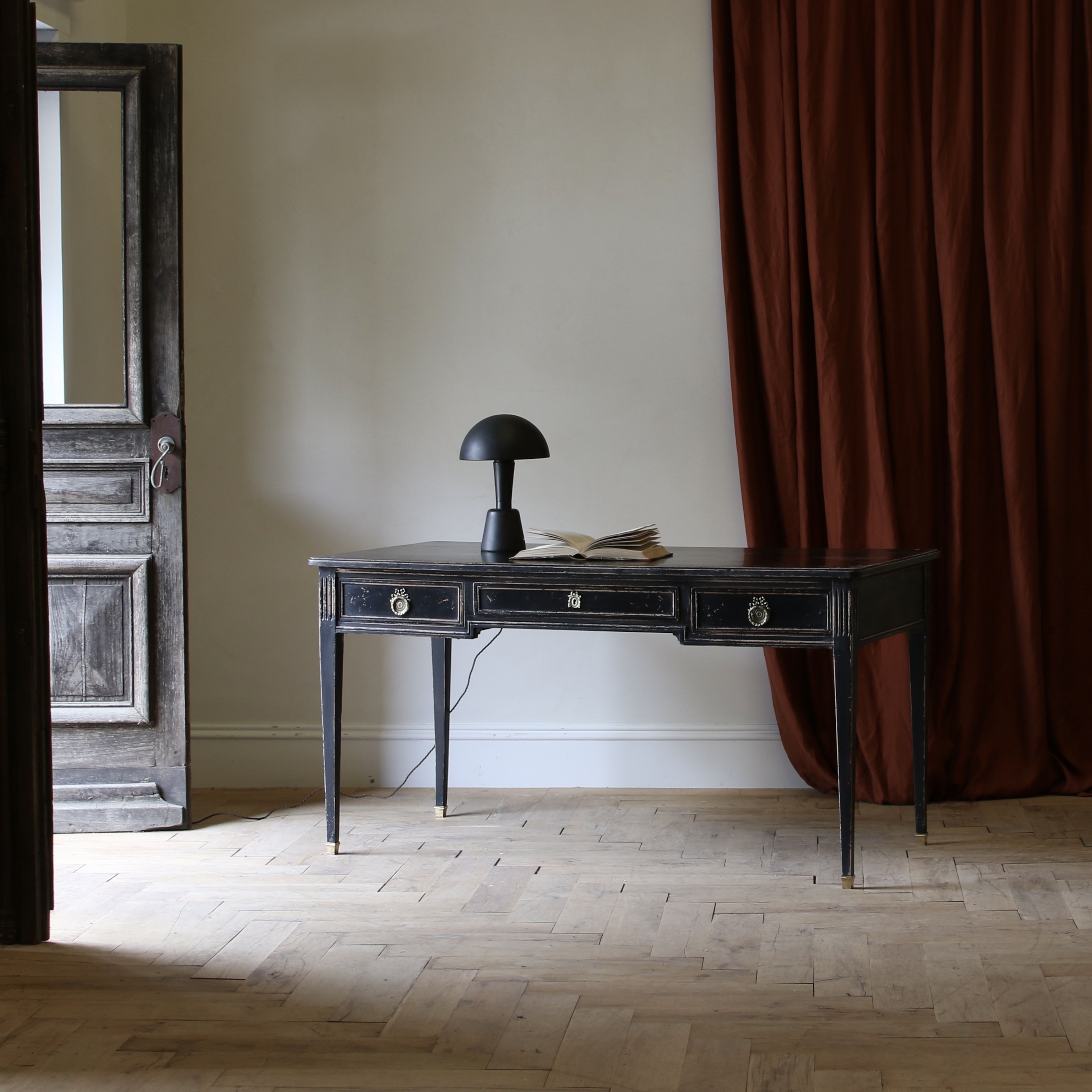 An Ebonised Bureau Plat