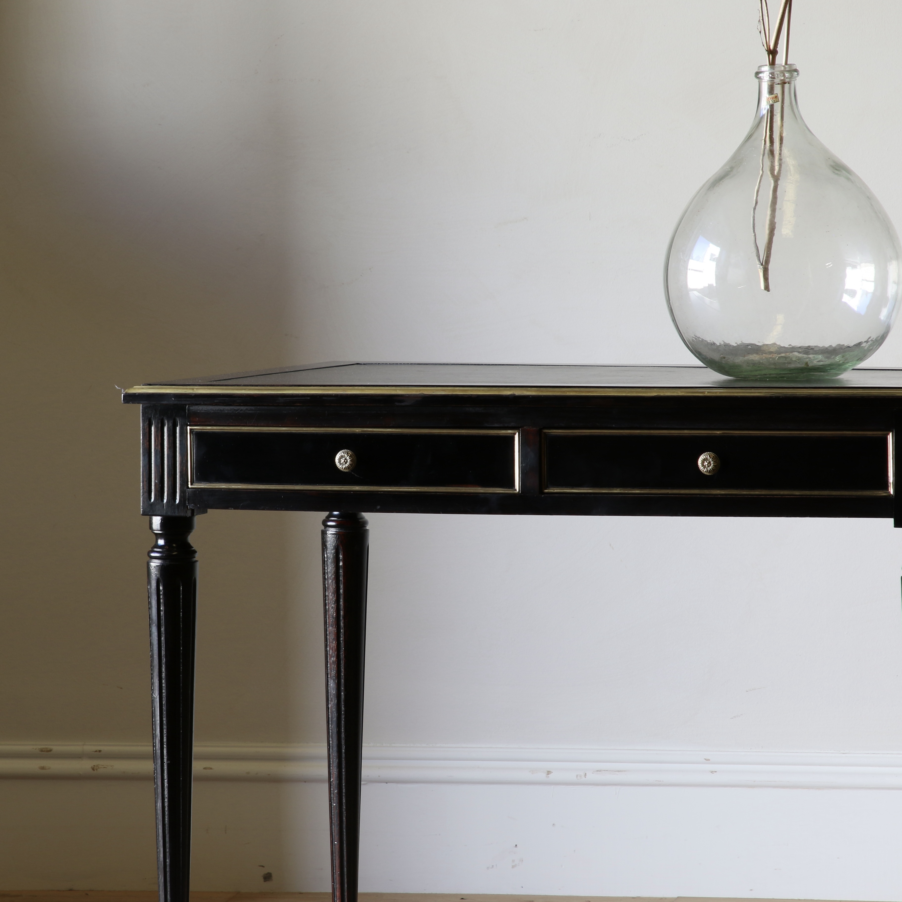 An Ebonised Bureau Plat