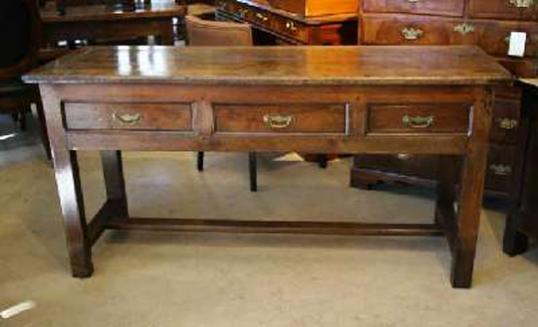 A three drawer French Chestnut side table