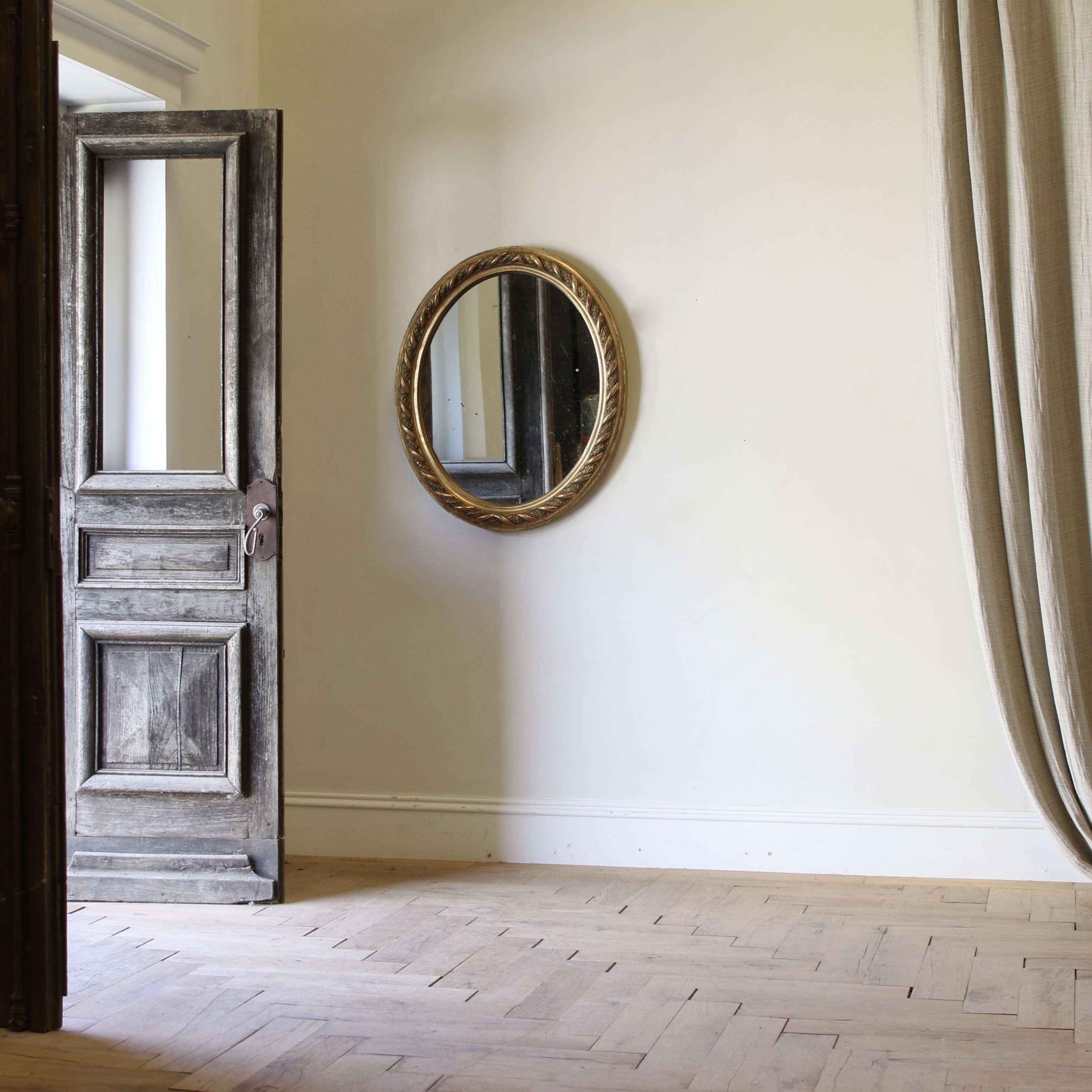 A Decorative French Gilt Oval Mirror