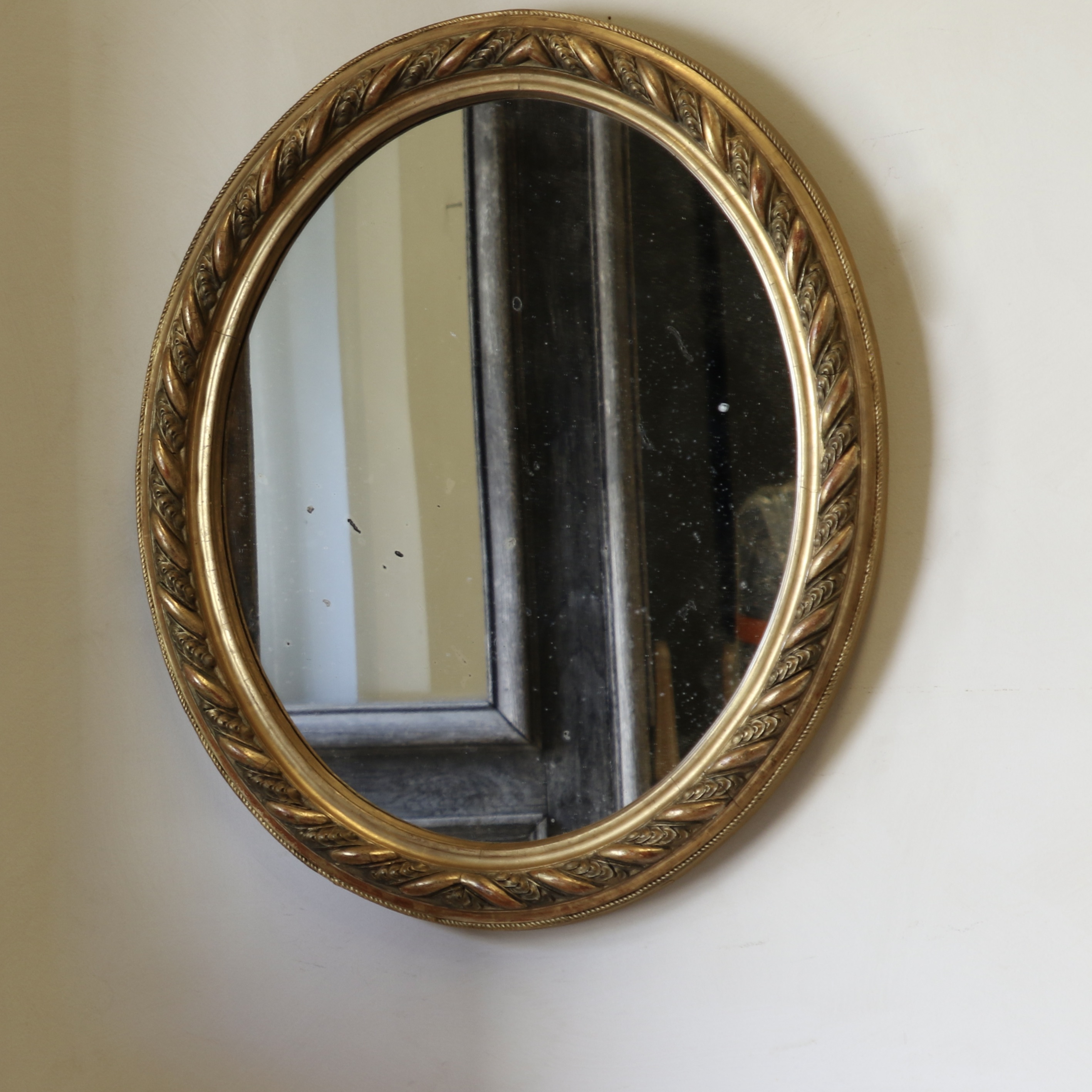 A Decorative French Gilt Oval Mirror