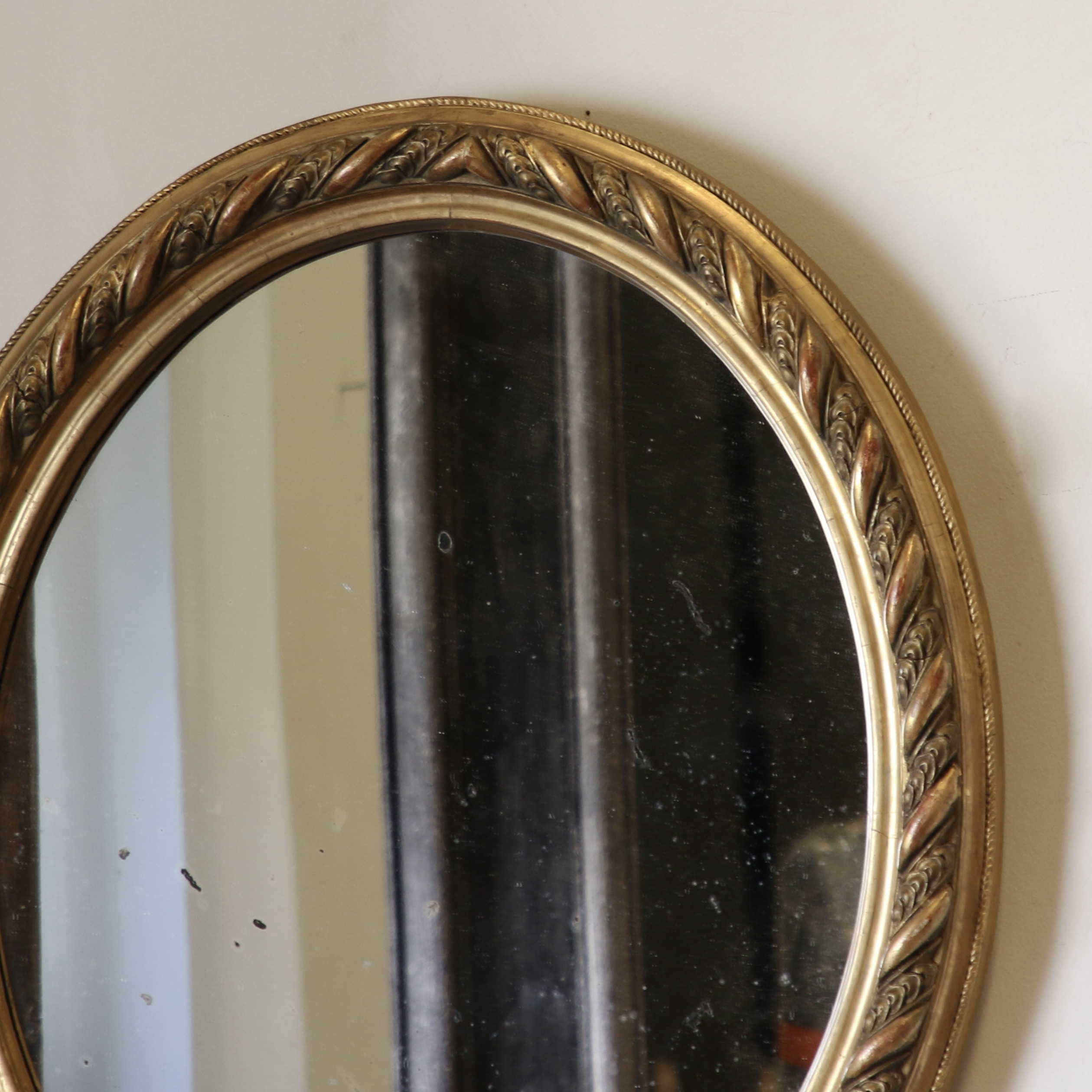A Decorative French Gilt Oval Mirror